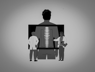 two doctors looking at an xray of a spine